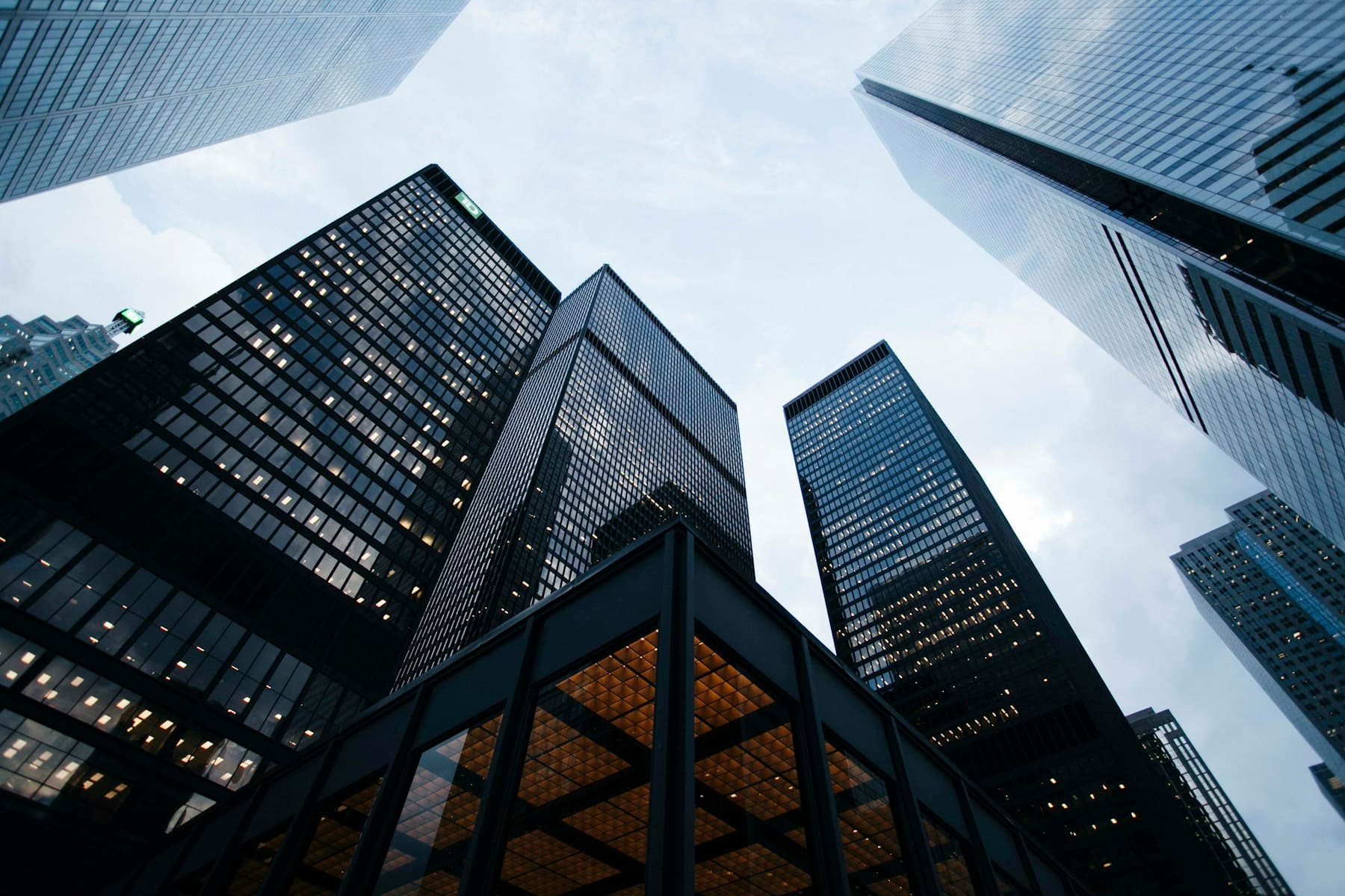 Looking up through a modern glass business district